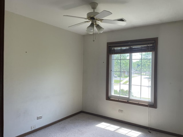 216 Charleston Ct Unit 8, Schaumburg, IL 60193 - spare room featuring light carpet and a ceiling fan