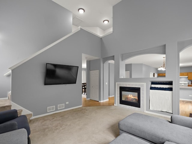 2019 Olde Mill Ln, Mchenry, IL 60050 - carpeted living area with a fireplace and arched walkways