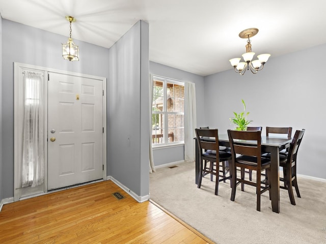 2019 Olde Mill Ln, Mchenry, IL 60050 - dining space with a chandelier and light wood-style flooring