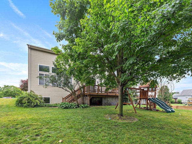 2019 Olde Mill Ln, Mchenry, IL 60050 - back of property featuring a playground, a yard, a wooden deck, and stairs