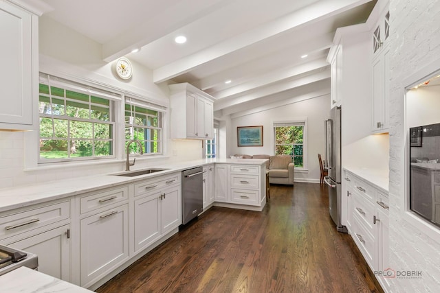 560 Golf Ln, Lake Forest, IL 60045 - kitchen with appliances with stainless steel finishes, white cabinetry, a peninsula, light stone counters, and dark wood-type flooring