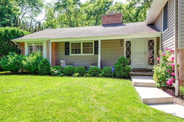 560 Golf Ln, Lake Forest, IL 60045 - view of front facade featuring a front yard and a chimney