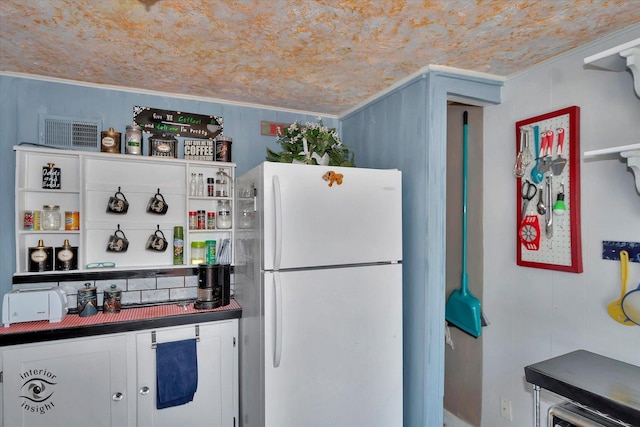 10730 S Ridgeland St, Worth, IL 60482 - kitchen with freestanding refrigerator and dark countertops
