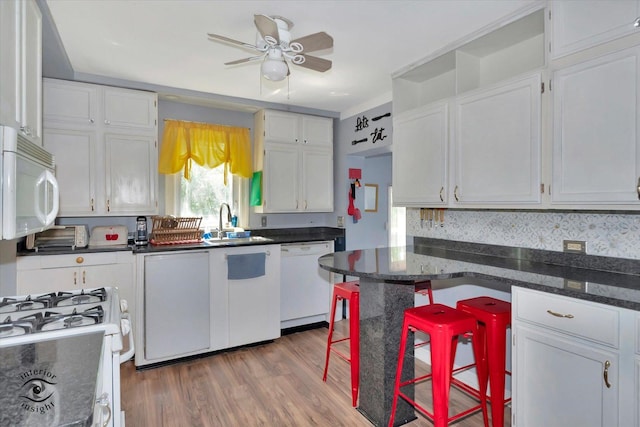 10730 S Ridgeland St, Worth, IL 60482 - kitchen featuring white appliances, white cabinetry, ceiling fan, and light wood-type flooring