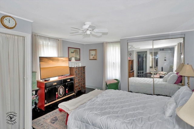 10730 S Ridgeland St, Worth, IL 60482 - bedroom featuring multiple windows, a ceiling fan, and a closet