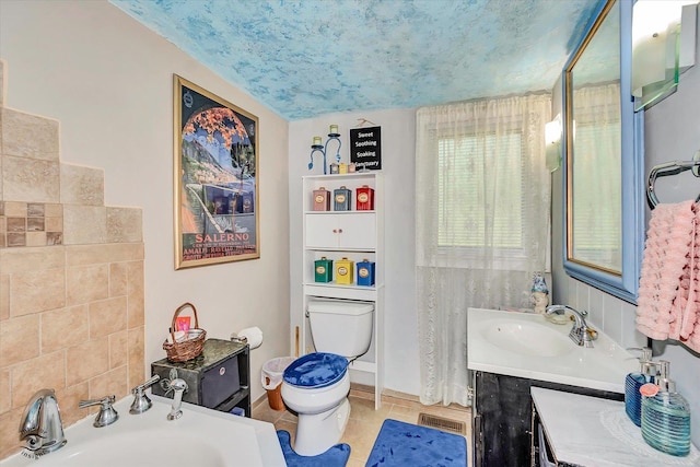 10730 S Ridgeland St, Worth, IL 60482 - bathroom featuring a garden tub, vanity, and tile patterned flooring