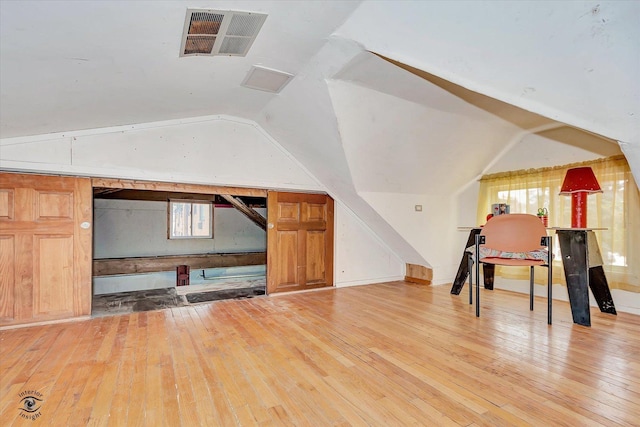 10730 S Ridgeland St, Worth, IL 60482 - additional living space with hardwood / wood-style floors and lofted ceiling