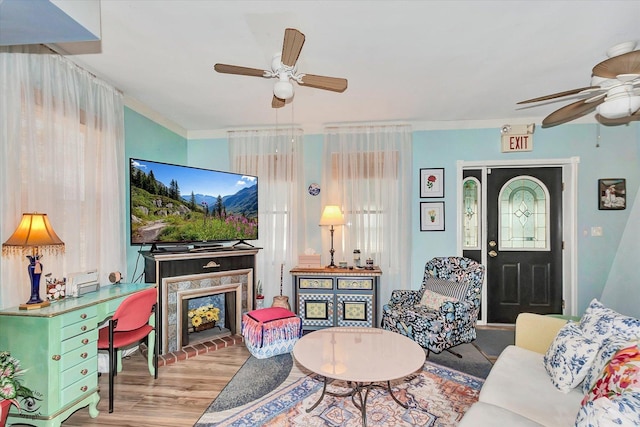 10730 S Ridgeland St, Worth, IL 60482 - living room featuring a ceiling fan, wood finished floors, plenty of natural light, and crown molding