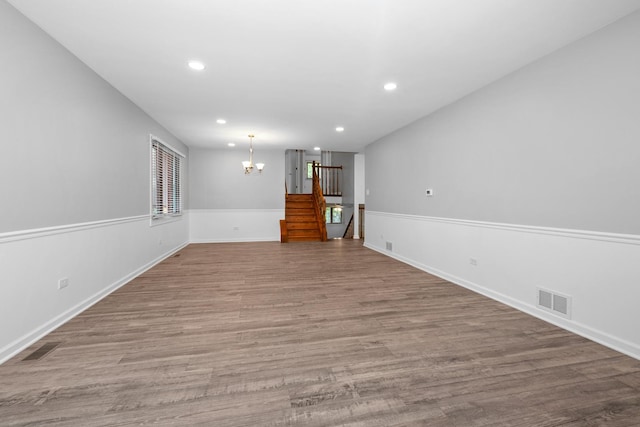 12123 S 72nd Ct, Palos Heights, IL 60463 - unfurnished living room featuring a chandelier, recessed lighting, wood finished floors, and stairway