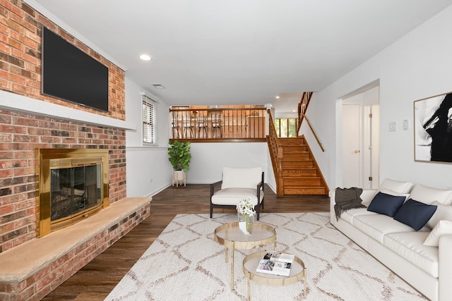 12123 S 72nd Ct, Palos Heights, IL 60463 - living area with wood finished floors, stairs, a brick fireplace, and recessed lighting