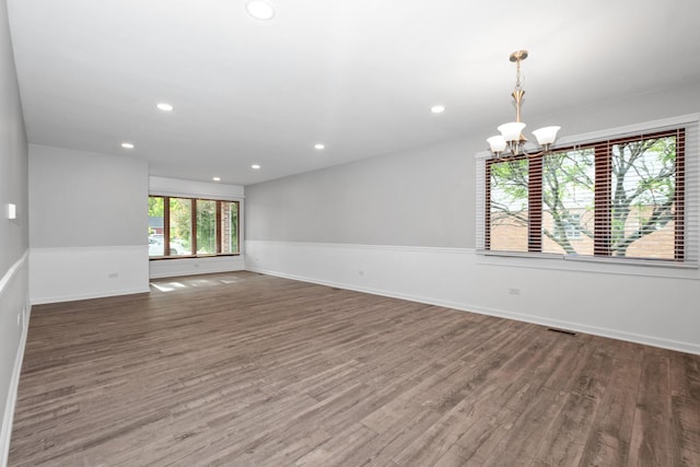 12123 S 72nd Ct, Palos Heights, IL 60463 - spare room featuring a chandelier, wood finished floors, and recessed lighting