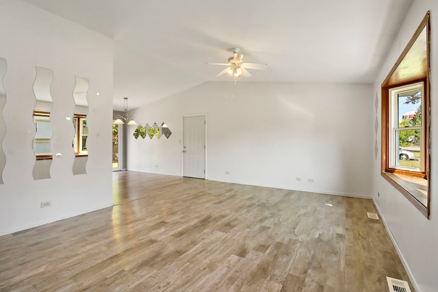 4113 Luckie Ct, Zion, IL 60099 - unfurnished living room featuring plenty of natural light, a ceiling fan, lofted ceiling, and light wood-style floors