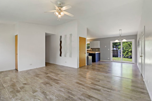 4113 Luckie Ct, Zion, IL 60099 - unfurnished living room featuring a ceiling fan, wood finished floors, and high vaulted ceiling