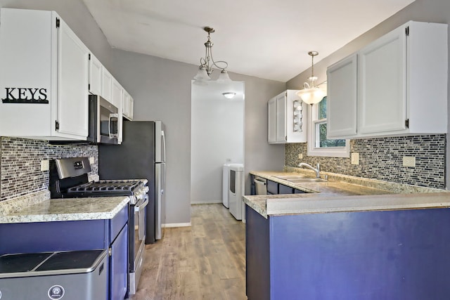 4113 Luckie Ct, Zion, IL 60099 - kitchen featuring stainless steel appliances, light countertops, backsplash, and light wood finished floors