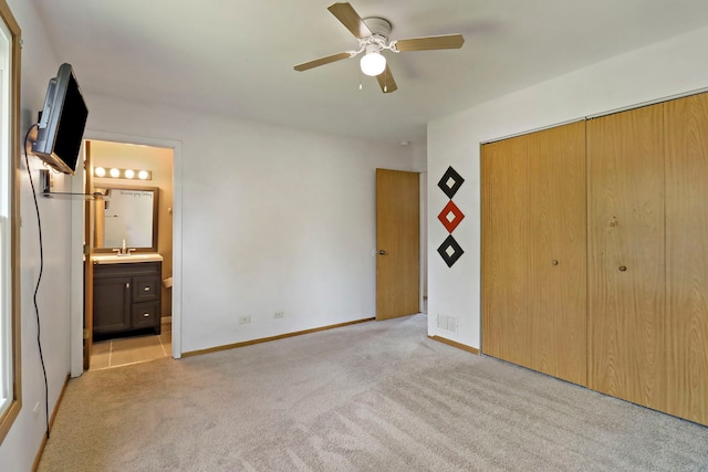 4113 Luckie Ct, Zion, IL 60099 - unfurnished bedroom with light colored carpet, a closet, ensuite bathroom, and ceiling fan