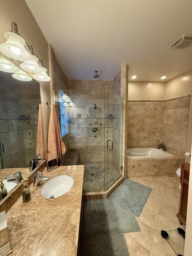 1621 W Le Moyne St Unit 1W, Chicago, IL 60622 - bathroom featuring vanity, a stall shower, tile patterned flooring, and a bath