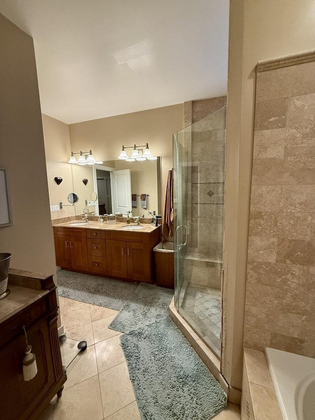 1621 W Le Moyne St Unit 1W, Chicago, IL 60622 - bathroom with a shower stall, double vanity, tile patterned flooring, and tiled bath