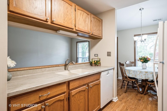 5145 Pembrook Ct, Gurnee, IL 60031 - kitchen featuring white appliances, light wood-type flooring, decorative light fixtures, a chandelier, and brown cabinetry