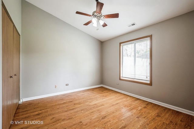 5145 Pembrook Ct, Gurnee, IL 60031 - empty room with lofted ceiling, light wood-style floors, and a ceiling fan