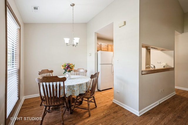 5145 Pembrook Ct, Gurnee, IL 60031 - dining area featuring a chandelier, healthy amount of natural light, and light wood-type flooring