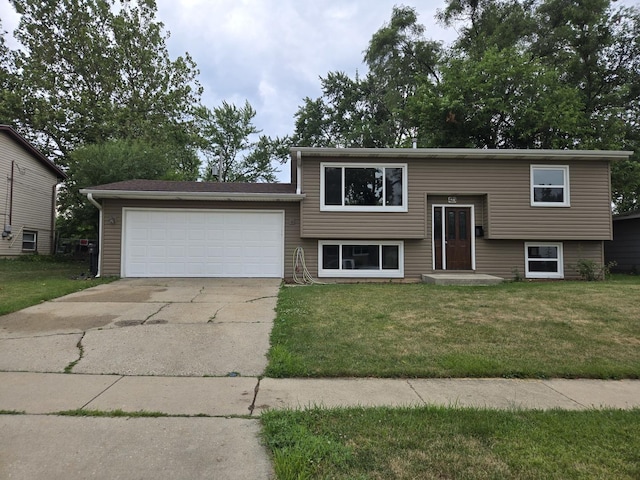 423 W Walnut Dr, Streamwood, IL 60107 - split foyer home with an attached garage, concrete driveway, and a front lawn