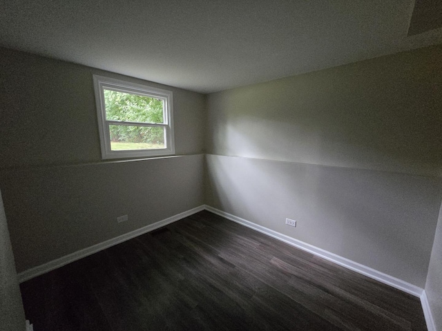 423 W Walnut Dr, Streamwood, IL 60107 - empty room with dark wood-style flooring and baseboards