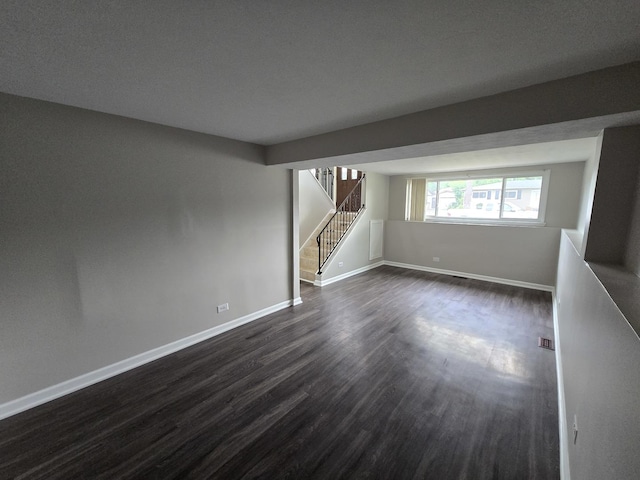 423 W Walnut Dr, Streamwood, IL 60107 - spare room with dark wood finished floors and stairs