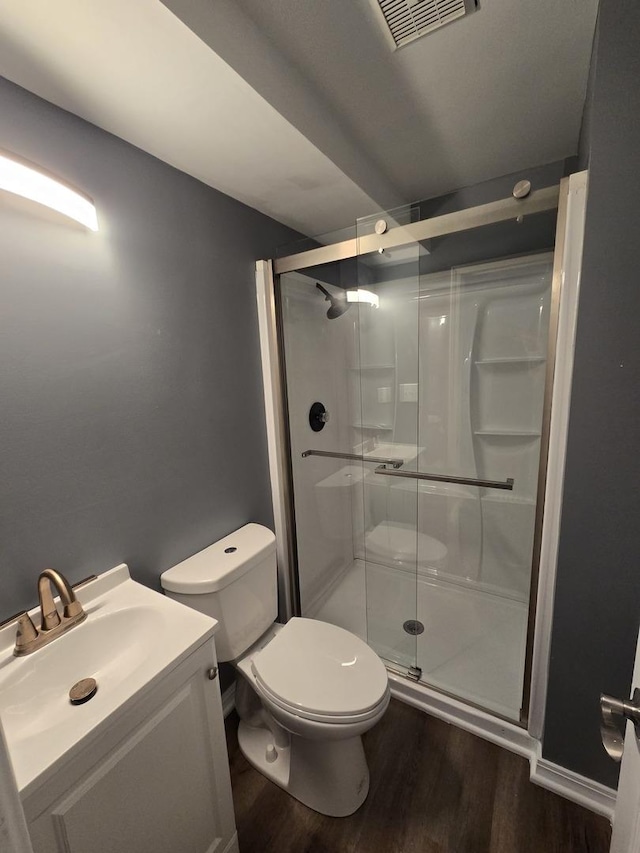 423 W Walnut Dr, Streamwood, IL 60107 - bathroom with wood finished floors, a stall shower, and vanity