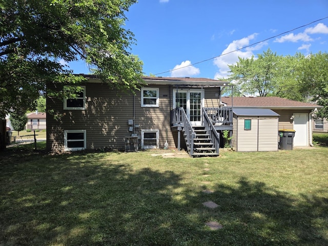 423 W Walnut Dr, Streamwood, IL 60107 - rear view of property featuring stairway, a wooden deck, a yard, and a storage unit