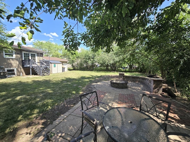 423 W Walnut Dr, Streamwood, IL 60107 - view of patio with an outdoor fire pit and an outdoor structure