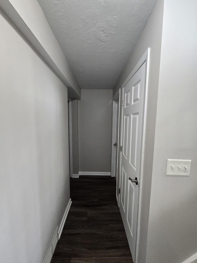 423 W Walnut Dr, Streamwood, IL 60107 - corridor with dark wood-type flooring and a textured ceiling