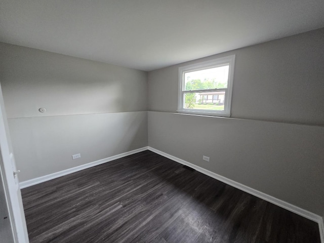 423 W Walnut Dr, Streamwood, IL 60107 - unfurnished room with dark wood-type flooring and baseboards