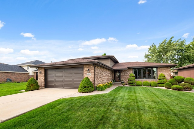 8648 Carriage Ln, Tinley Park, IL 60487 - view of front of home featuring brick siding, a garage, concrete driveway, and a front lawn