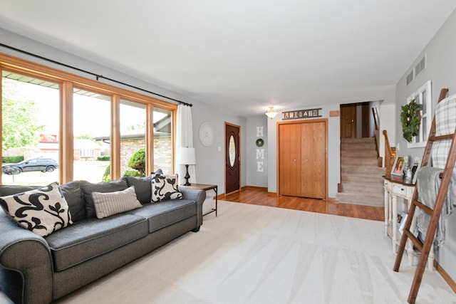 8648 Carriage Ln, Tinley Park, IL 60487 - living room featuring light colored carpet and stairs