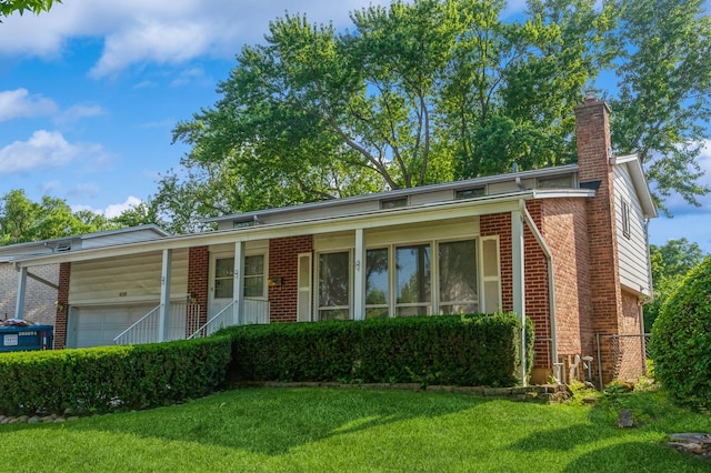 626 Barberry Rd, Highland Park, IL 60035 - view of front of home featuring brick siding, a front lawn, a chimney, and a porch