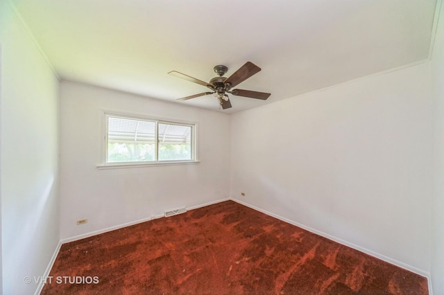 626 Barberry Rd, Highland Park, IL 60035 - spare room with a ceiling fan and dark carpet