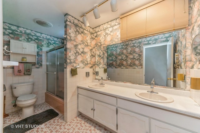 626 Barberry Rd, Highland Park, IL 60035 - bathroom featuring tile walls, wallpapered walls, double vanity, and enclosed tub / shower combo