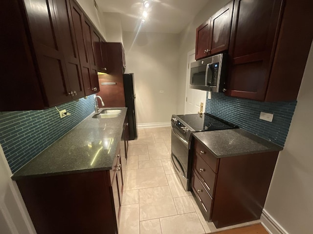 6257 N Sheridan Rd Unit 39, Chicago, IL 60660 - kitchen featuring appliances with stainless steel finishes, backsplash, and dark stone countertops