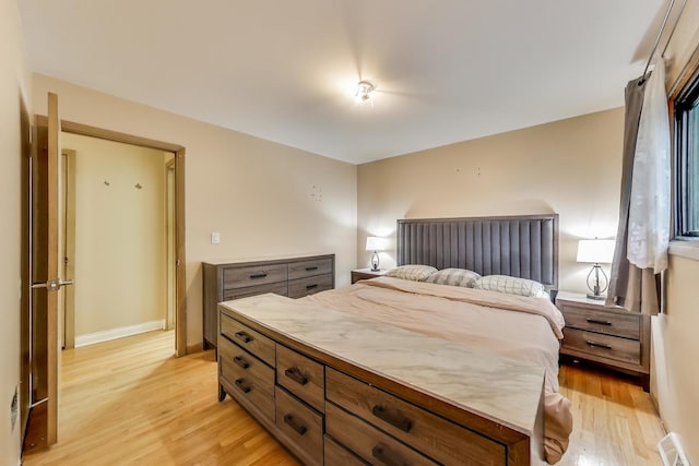 126 Oak Ave, Wood Dale, IL 60191 - bedroom with light wood finished floors and baseboards