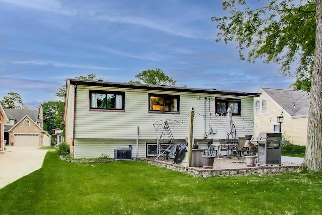 126 Oak Ave, Wood Dale, IL 60191 - rear view of house with a lawn and a patio