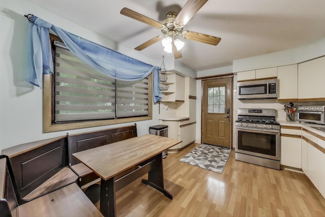 126 Oak Ave, Wood Dale, IL 60191 - kitchen with stainless steel appliances, light wood-style floors, white cabinetry, and light countertops