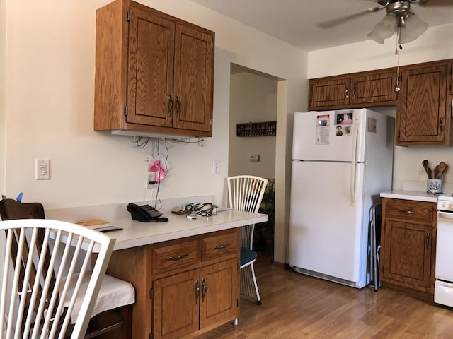181 Saenz Ln Unit 181, Joliet, IL 60436 - kitchen with white appliances, light countertops, ceiling fan, and a kitchen breakfast bar