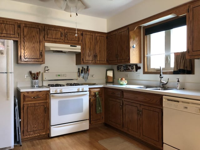 181 Saenz Ln Unit 181, Joliet, IL 60436 - kitchen with white appliances, under cabinet range hood, light countertops, wood finished floors, and a ceiling fan