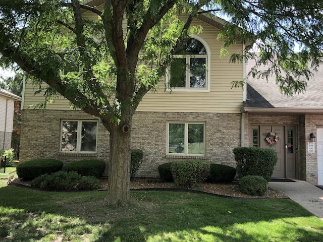 181 Saenz Ln Unit 181, Joliet, IL 60436 - view of front facade with a front yard and brick siding