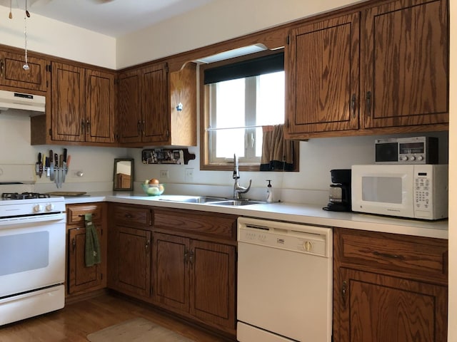 181 Saenz Ln Unit 181, Joliet, IL 60436 - kitchen featuring white appliances, light countertops, under cabinet range hood, and wood finished floors