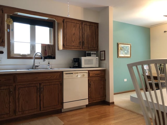 181 Saenz Ln Unit 181, Joliet, IL 60436 - kitchen featuring white appliances, light wood finished floors, and light countertops