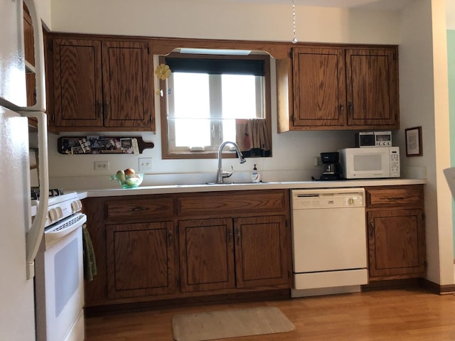181 Saenz Ln Unit 181, Joliet, IL 60436 - kitchen featuring white appliances, light countertops, and light wood-type flooring