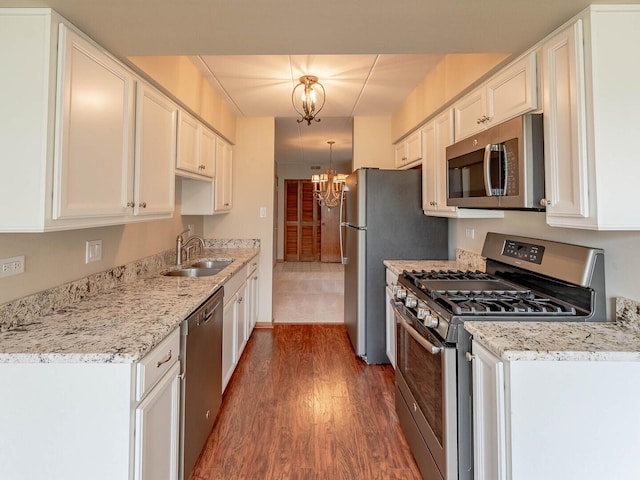4948 Circle Ct Unit 704, Crestwood, IL 60418 - kitchen with stainless steel appliances, a chandelier, dark wood-style flooring, white cabinetry, and light stone counters