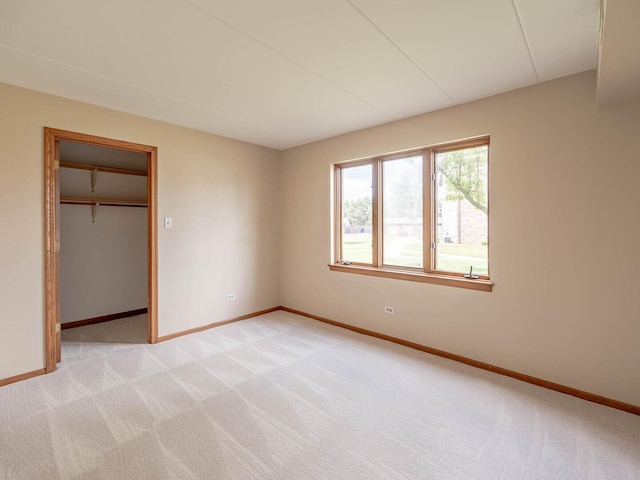 4948 Circle Ct Unit 704, Crestwood, IL 60418 - unfurnished bedroom featuring light colored carpet, a walk in closet, and a closet