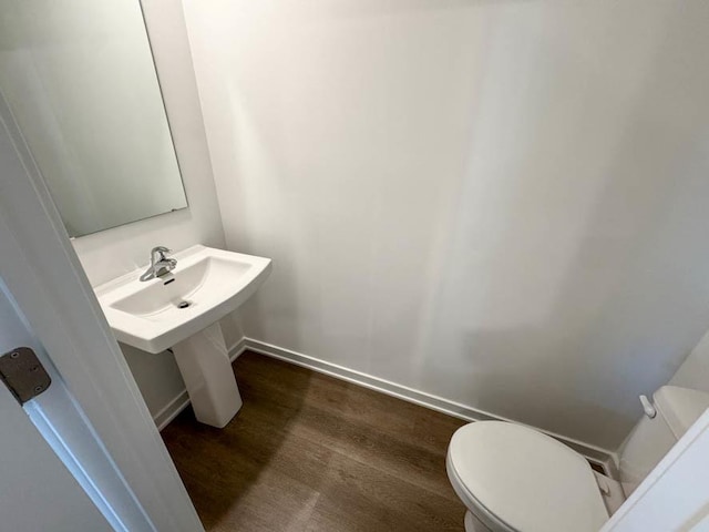 1120 58th Rd Unit 0012, Union Grove, WI 53182 - half bath with toilet and wood finished floors